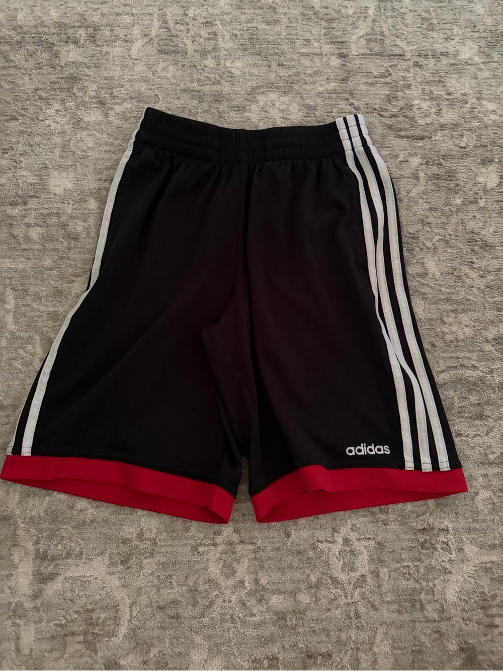adidas Black Athletic Shorts with White Stripes and Red Hem